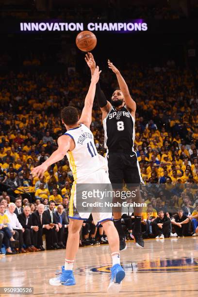 Patty Mills of the San Antonio Spurs shoots the ball against the Golden State Warriors in Game Five of Round One of the 2018 NBA Playoffs on April...