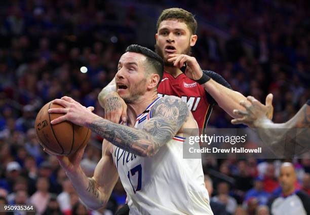 Redick of the Philadelphia 76ers gets fouled by Tyler Johnson of the Miami Heat at Wells Fargo Center on April 24, 2018 in Philadelphia, Pennsylvania.