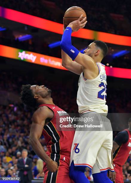 Ben Simmons of the Philadelphia 76ers puts up a shot over Justise Winslow of the Miami Heat at Wells Fargo Center on April 24, 2018 in Philadelphia,...