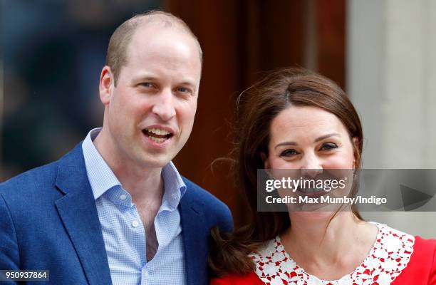 Prince William, Duke of Cambridge and Catherine, Duchess of Cambridge depart the Lindo Wing of St Mary's Hospital with their newborn baby son on...