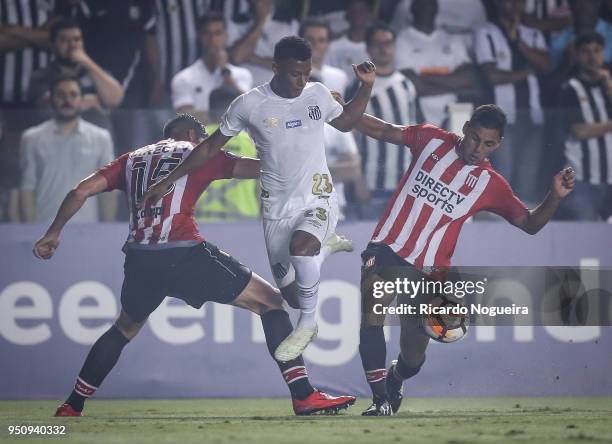 Arthur Gomes of Santos battles for the ball with Campi and Ruiz Dias of Estudiantesduring the match between Santos and Estudiantes as a part of Copa...