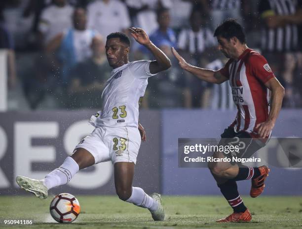 Arthur Gomes of Santos battles for the ball with Brona of Estudiantesduring the match between Santos and Estudiantes as a part of Copa Libertadores...