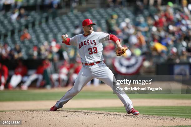 Jim Johnson of the Los Angeles Angels of Anaheim pitches during the game against the Oakland Athletics at the Oakland Alameda Coliseum on March 31,...