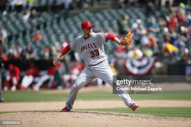 Jim Johnson of the Los Angeles Angels of Anaheim pitches during the game against the Oakland Athletics at the Oakland Alameda Coliseum on March 31,...