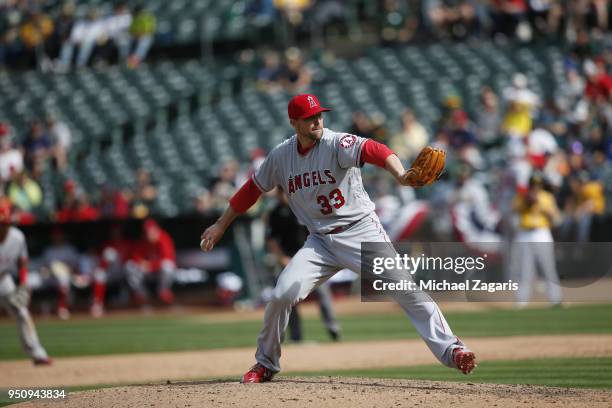 Jim Johnson of the Los Angeles Angels of Anaheim pitches during the game against the Oakland Athletics at the Oakland Alameda Coliseum on March 31,...