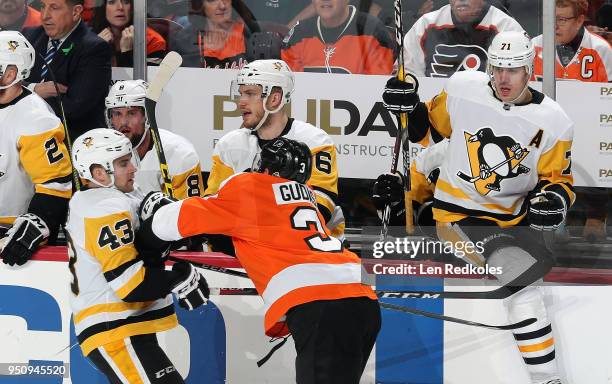 Radko Gudas of the Philadelphia Flyers battles Conor Sheary of the Pittsburgh Penguins in front of their bench in Game Four of the Eastern Conference...