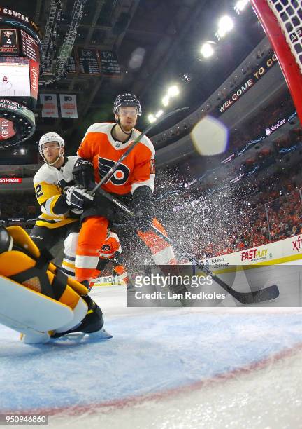Michael Raffl of the Philadelphia Flyers battles atop the crease against Chad Ruhwedel of the Pittsburgh Penguins in Game Four of the Eastern...