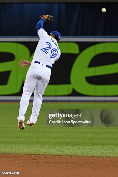 Toronto Blue Jays Second base Devon Travis can't make the catch on a single by Boston Red Sox Third base Rafael Devers during the regular season MLB...