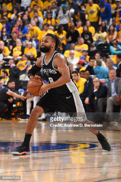 Patty Mills of the San Antonio Spurs passes the ball against the Golden State Warriors in Game Five of Round One of the 2018 NBA Playoffs on April...