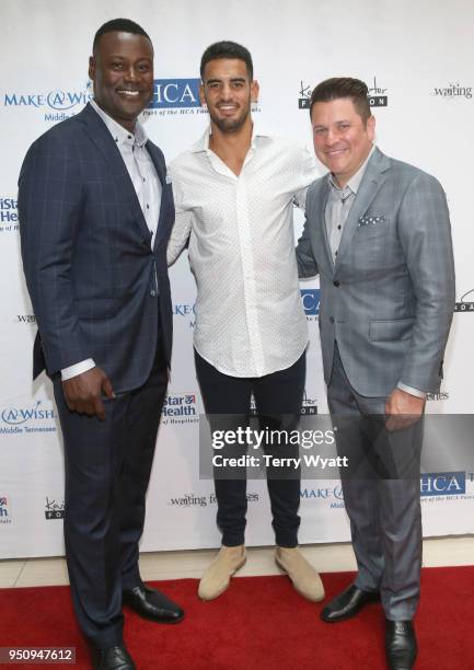 Host Kevin Carter, Titans quarterback Marcus Mariota and host Jay DeMarcus attend the 17th annual Waiting for Wishes celebrity dinner at The Palm on...