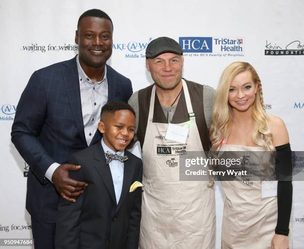 Host Kevin Carter, Make-A-Wish child, Kayden, UFC fighter Randy Couture and actress Mindy Robinson attend the 17th annual Waiting for Wishes...