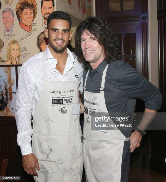 Titans quarterback Marcus Mariota and KISS guitarist Tommy Thayer wait tables at the 17th annual Waiting for Wishes celebrity dinner at The Palm on...