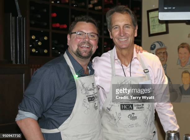 Storme Warren and NFL veteran Chris Collinsworth wait tables during the 17th annual Waiting for Wishes celebrity dinner at The Palm on April 24, 2018...