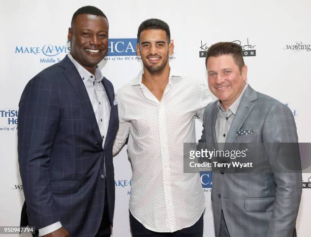 Host Kevin Carter, Titans quarterback Marcus Mariota and host Jay DeMarcus attend the 17th annual Waiting for Wishes celebrity dinner at The Palm on...