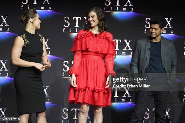 Actors Ronda Rousey, Lauren Cohan and Iko Uwais speak onstage during the STXfilms presentation at The Colosseum at Caesars Palace during CinemaCon,...