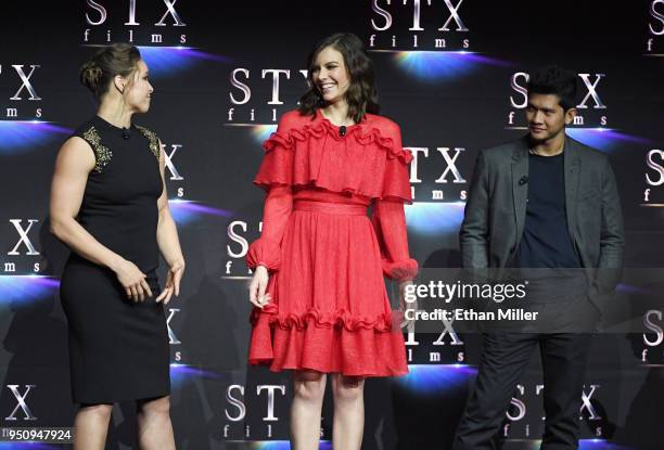 Actors Ronda Rousey, Lauren Cohan and Iko Uwais speak onstage during the STXfilms presentation at The Colosseum at Caesars Palace during CinemaCon,...