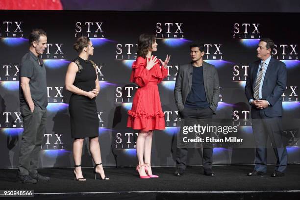 Director Peter Berg, actors Ronda Rousey, Lauren Cohan, Iko Uwais and STXfilms Chairman Adam Fogelson speak onstage during the STXfilms presentation...