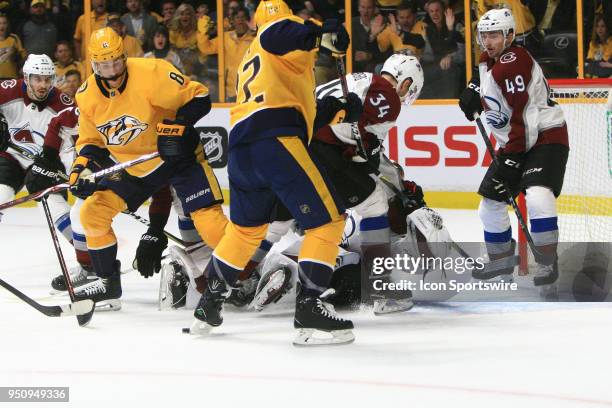 Colorado Avalanche defenseman Samuel Girard , goalie Andrew Hammond and center Carl Soderberg defend as Nashville Predators center Kyle Turris and...