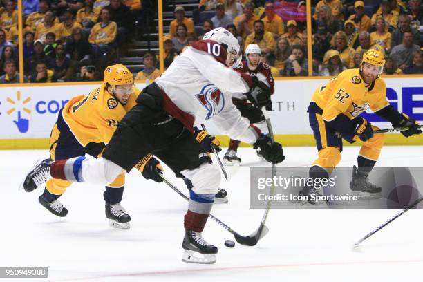 Nashville Predators winger Calle Jarnkrok defends against Colorado Avalanche left wing Sven Andrighetto during Game Five of Round One of the Stanley...