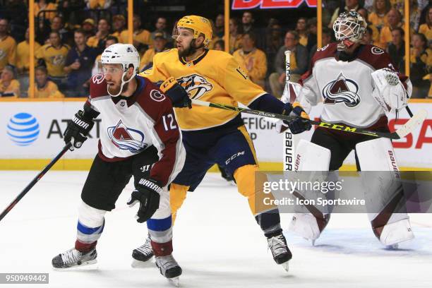 Colorado Avalanche defenseman Patrik Nemeth and Nashville Predators center Nick Bonino battle for position in front of Colorado Avalanche goalie...