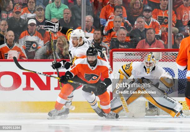 Radko Gudas of the Philadelphia Flyers battles on a scoring opportunity against Jamie Oleksiak and Matthew Murray of the Pittsburgh Penguins in Game...