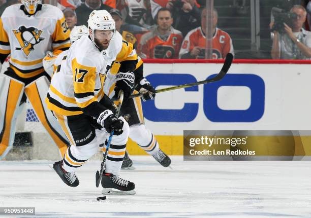 Bryan Rust of the Pittsburgh Penguins skates the puck against the Philadelphia Flyers in Game Four of the Eastern Conference First Round during the...