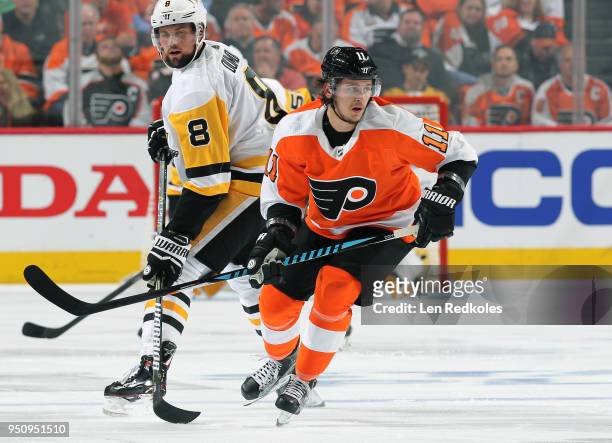 Travis Konecny of the Philadelphia Flyers skates against Brian Dumoulin of the Pittsburgh Penguins in Game Four of the Eastern Conference First Round...