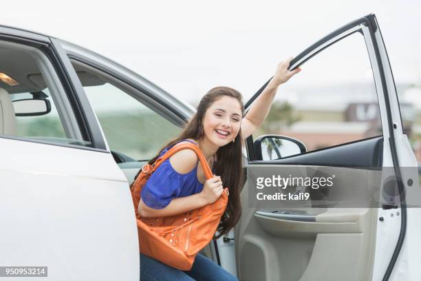 teenage girl, passenger looking out car door - open day 14 stock pictures, royalty-free photos & images