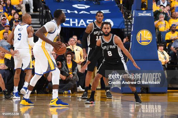 Patty Mills of the San Antonio Spurs plays defense against the Golden State Warriors in Game Five of Round One of the 2018 NBA Playoffs on April 24,...