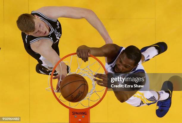 Kevin Durant of the Golden State Warriors dunks on Davis Bertans of the San Antonio Spurs during Game Five of Round One of the 2018 NBA Playoffs at...