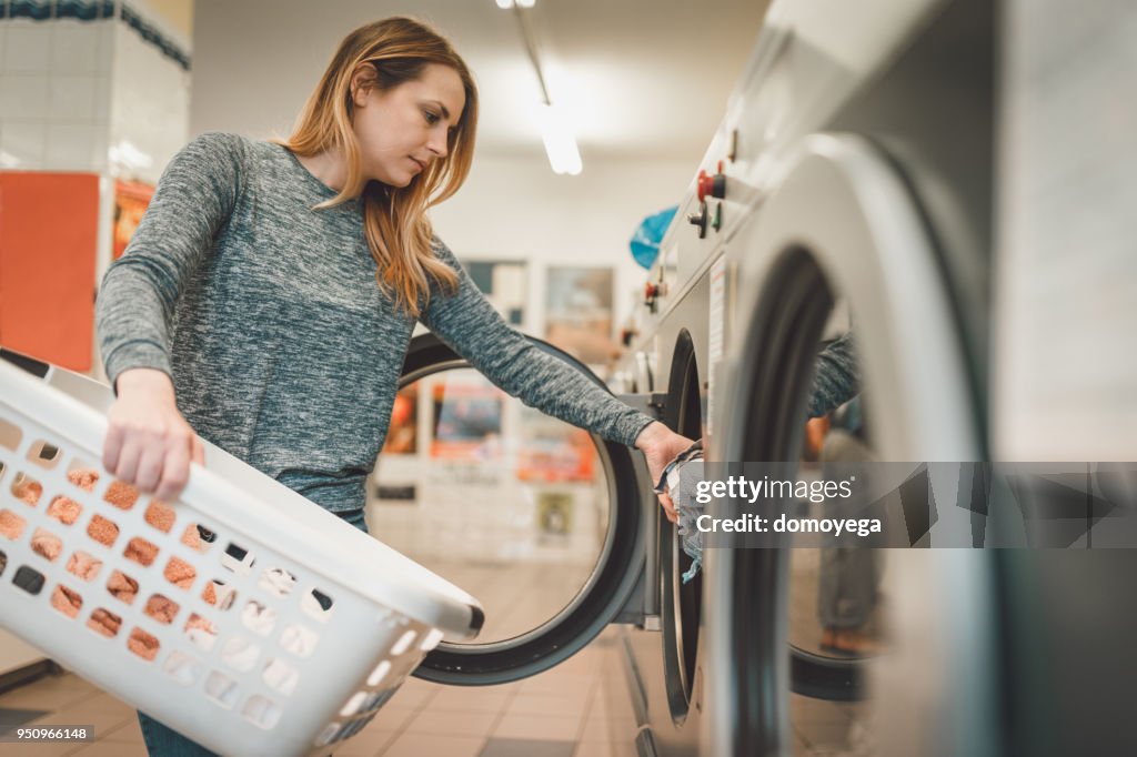 Woman Doing Laundry High-Res Stock Photo - Getty Images