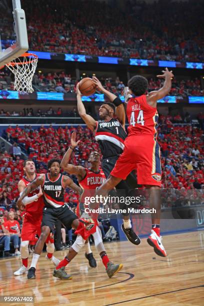 Evan Turner of the Portland Trail Blazers handles the ball against the New Orleans Pelicans in Game Four of Round One of the 2018 NBA Playoffs on...