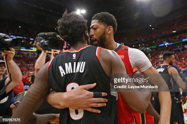 Anthony Davis of the New Orleans Pelicans and Al-Farouq Aminu of the Portland Trail Blazers greet each other after the game in Game Four of Round One...