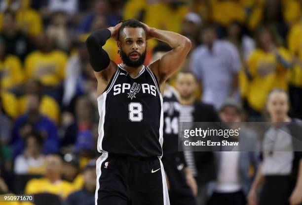 Patty Mills of the San Antonio Spurs reacts during Game Five against the Golden State Warriors of Round One of the 2018 NBA Playoffs at ORACLE Arena...
