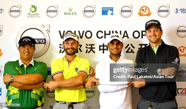 Kiradech Aphibarnrat of Thailand, Joost Luiten of the Netherlands, Shubhankar Sharma of India and Bernd Wiesberger of Austria, link hands during a...