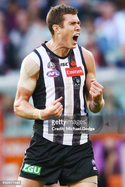 Mason Cox of the Magpies celebrates a goal during the round five AFL match between the Collingwood Magpies and the Essendon Bombvers at Melbourne...