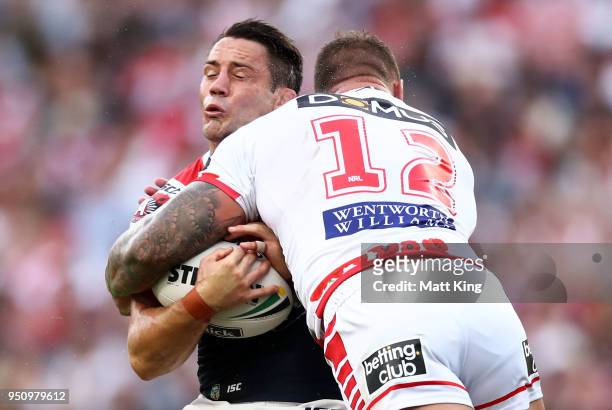 Cooper Cronk of the Roosters is tackled by Tariq Sims of the Dragons during the round eight NRL match between the St George Illawara Dragons and...