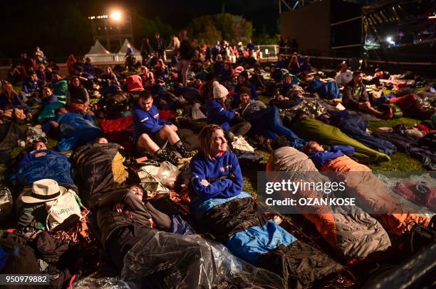 People attend a dawn service marking the 103rd anniversary of ANZAC Day in Canakkale, Turkey on April 25, 2018. - The April 25, 1915 landing of the...