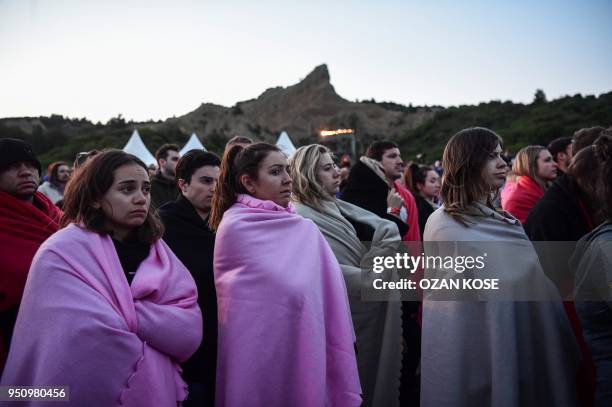 People attend a dawn service marking the 103rd anniversary of ANZAC Day in Canakkale, Turkey on April 25, 2018. - The April 25, 1915 landing of the...