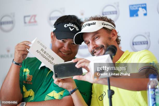 Kiradech Aphibarnrat of Thailand, Joost Luiten of Netherlands attend a press conference prior to the start of the 2018 Volvo China Open at Topwin...