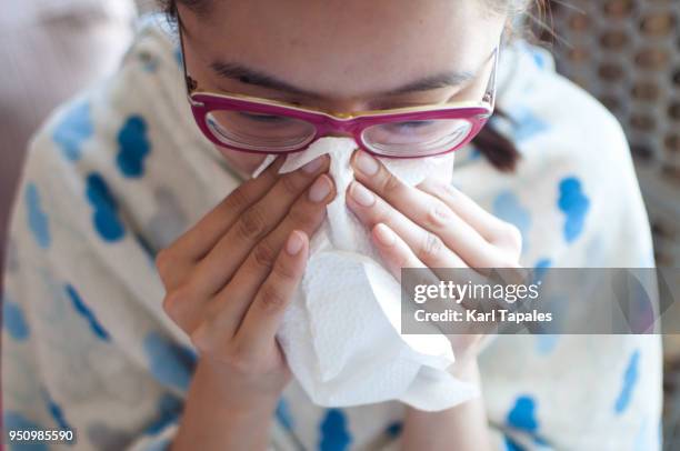 a young woman is having a flu - slijm stockfoto's en -beelden