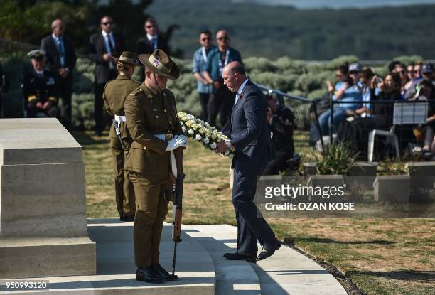 Australian Home Affairs Minister Peter Dutton lays a wreath during a ceremony marking the 103rd anniversary of ANZAC Day at Lone Pine Cemetery on the...