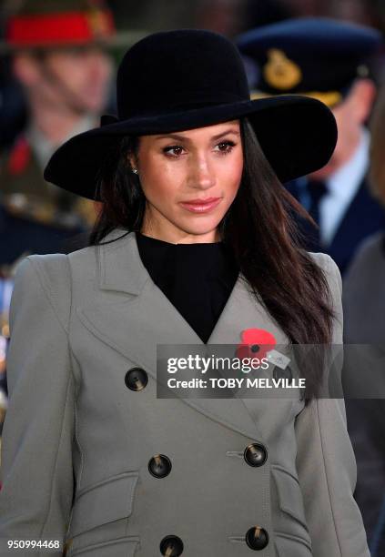 Meghan Markle, the US fiancee of Britain's Prince Harry, attends an Anzac Day dawn service at Hyde Park Corner in London on April 25, 2018. Anzac Day...