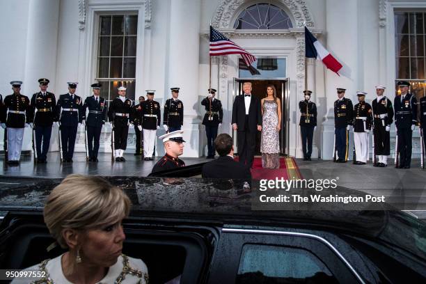 President Donald J. Trump and first lady Melania Trump greet French President Emmanuel Macron and his wife Brigitte Macron at the North Portico as...