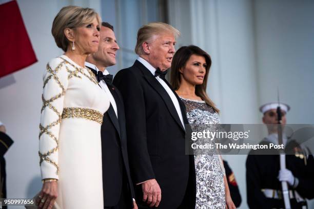 President Donald J. Trump and first lady Melania Trump greet French President Emmanuel Macron and his wife Brigitte Macron at the North Portico as...