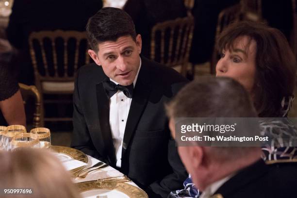 Speaker of the House Paul Ryan, R-Wis., talks with others before President Donald J. Trump and first lady Melania Trump host French President...