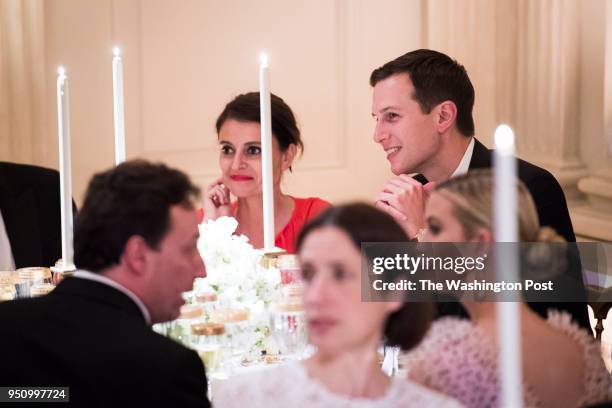 White House adviser Jared Kushner talks with others before President Donald J. Trump and first lady Melania Trump host French President Emmanuel...