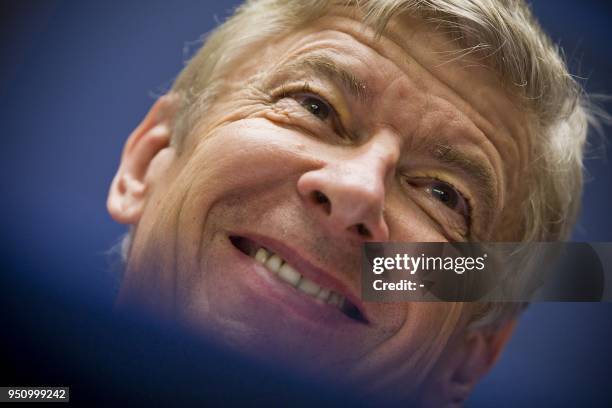 Arsenal coach Arsene Wenger smiles as he talks to journalists during a press conference in Schiphol on October 19, 2009 on the eve of their Champions...