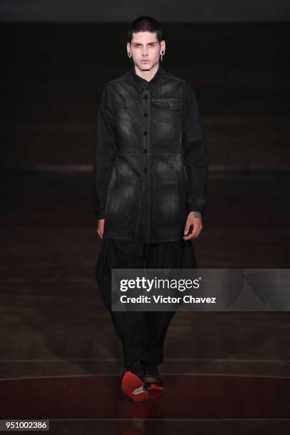 Model walks the runway during the Malafacha show at Mercedes Benz Fashion Week Mexico Fall/Winter 2018 on April 24, 2018 in Mexico City, Mexico.