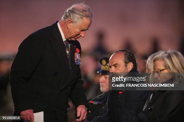 Britain's Prince Charles and French Prime Minister Edouard Philippe attend on April 25, 2018 ceremonies marking the 100th anniversary of ANZAC day in...